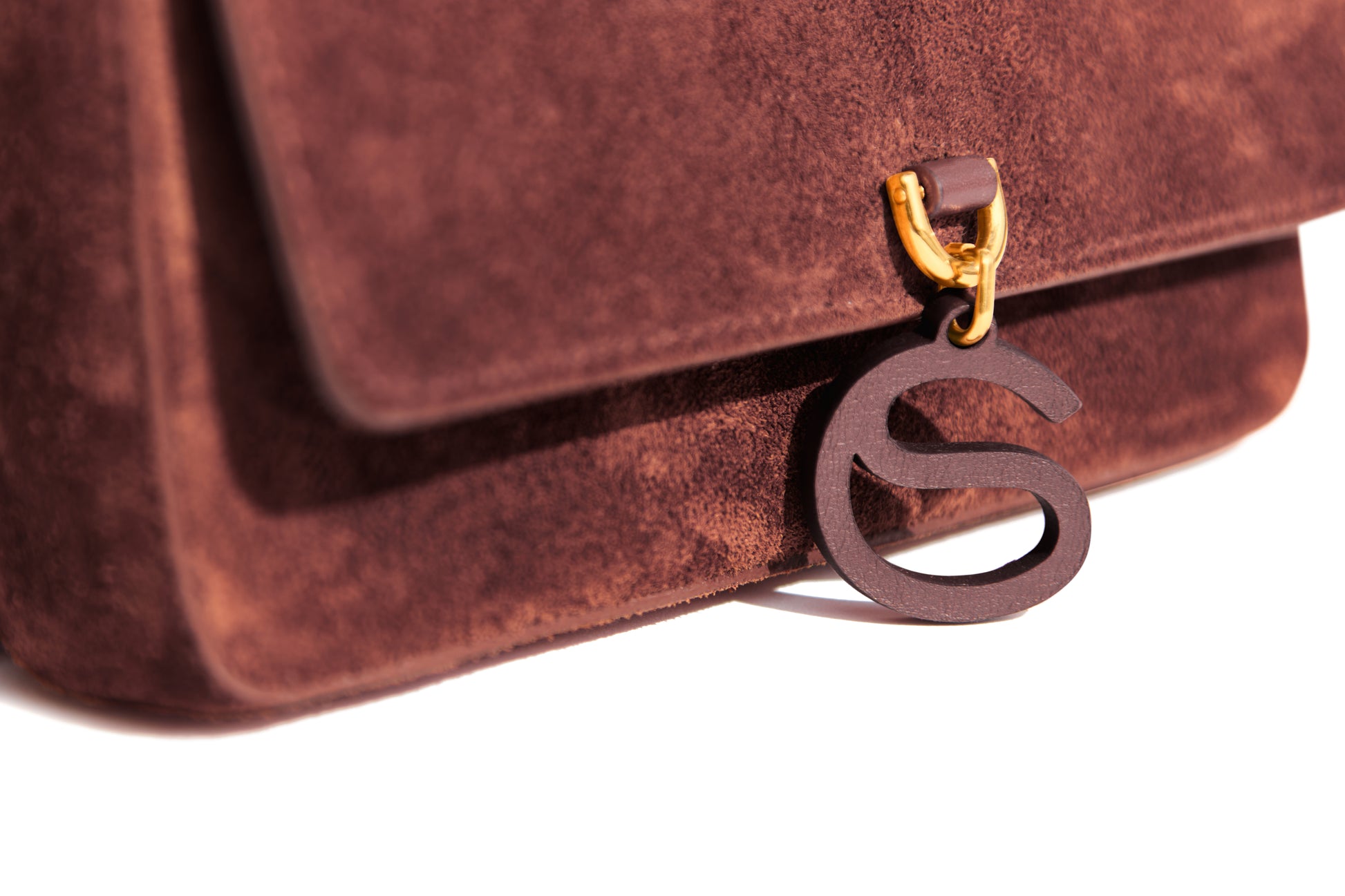 Aurora Bag Chocolate Red CS leather charm close up view
