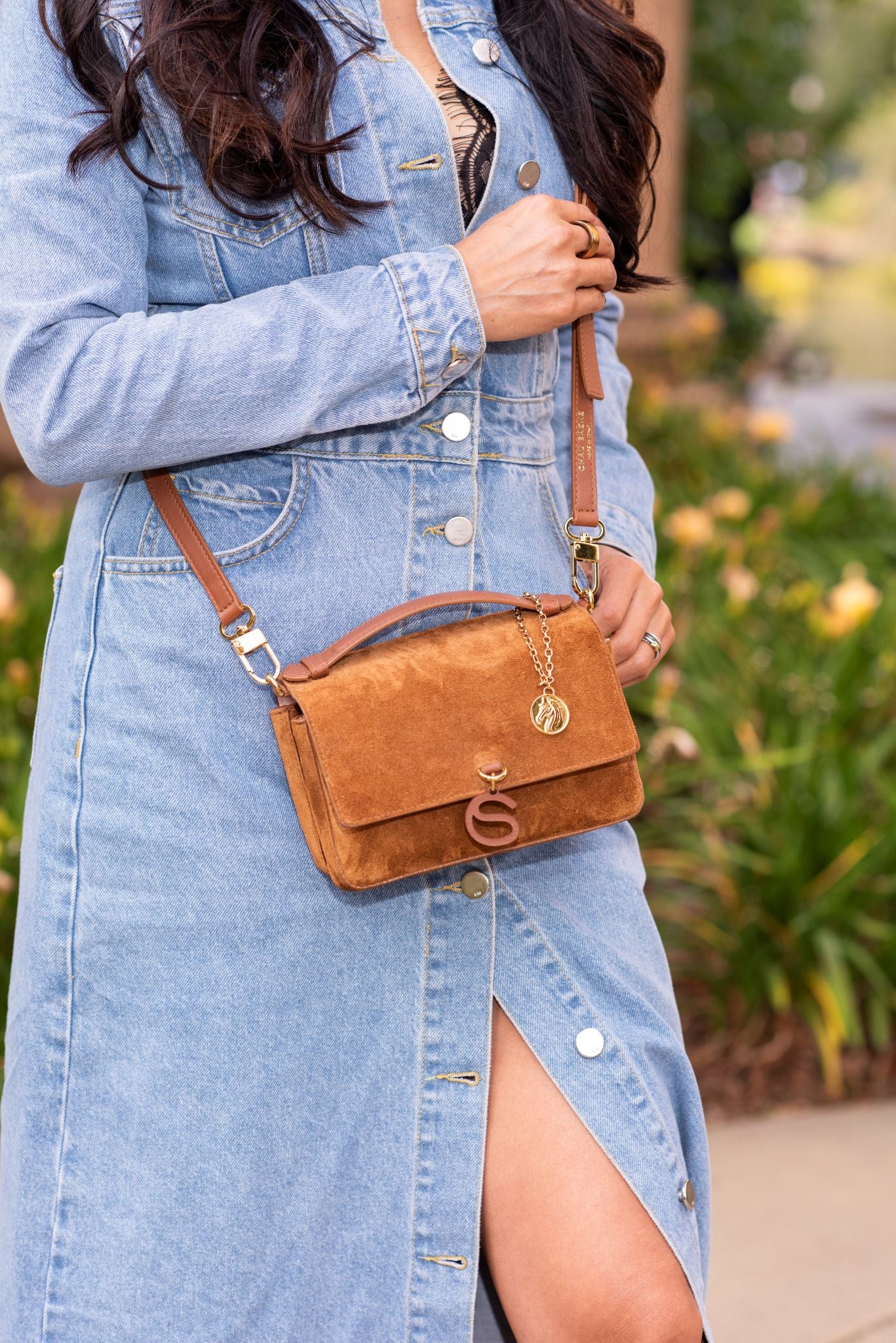 Model wearing Aurora Bag Camel cross body front view.