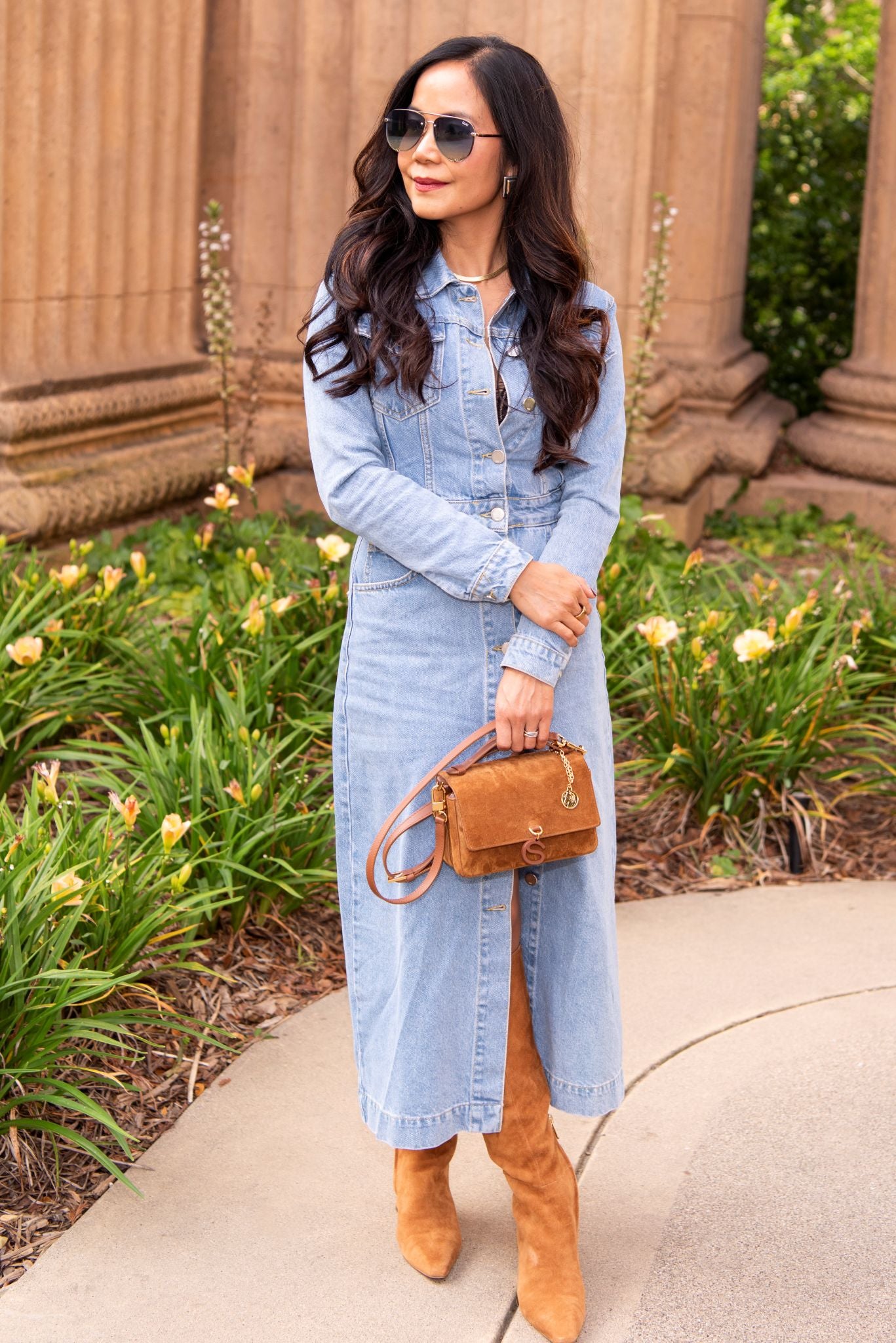 Model holding Aurora Bag Camel top handle front view